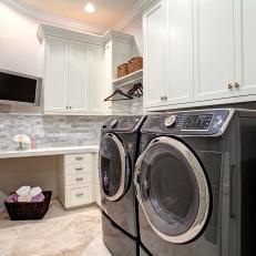 White Laundry Room With TV