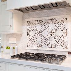 Decorative Black and White Kitchen Stove Backsplash Panel Over White Tile 