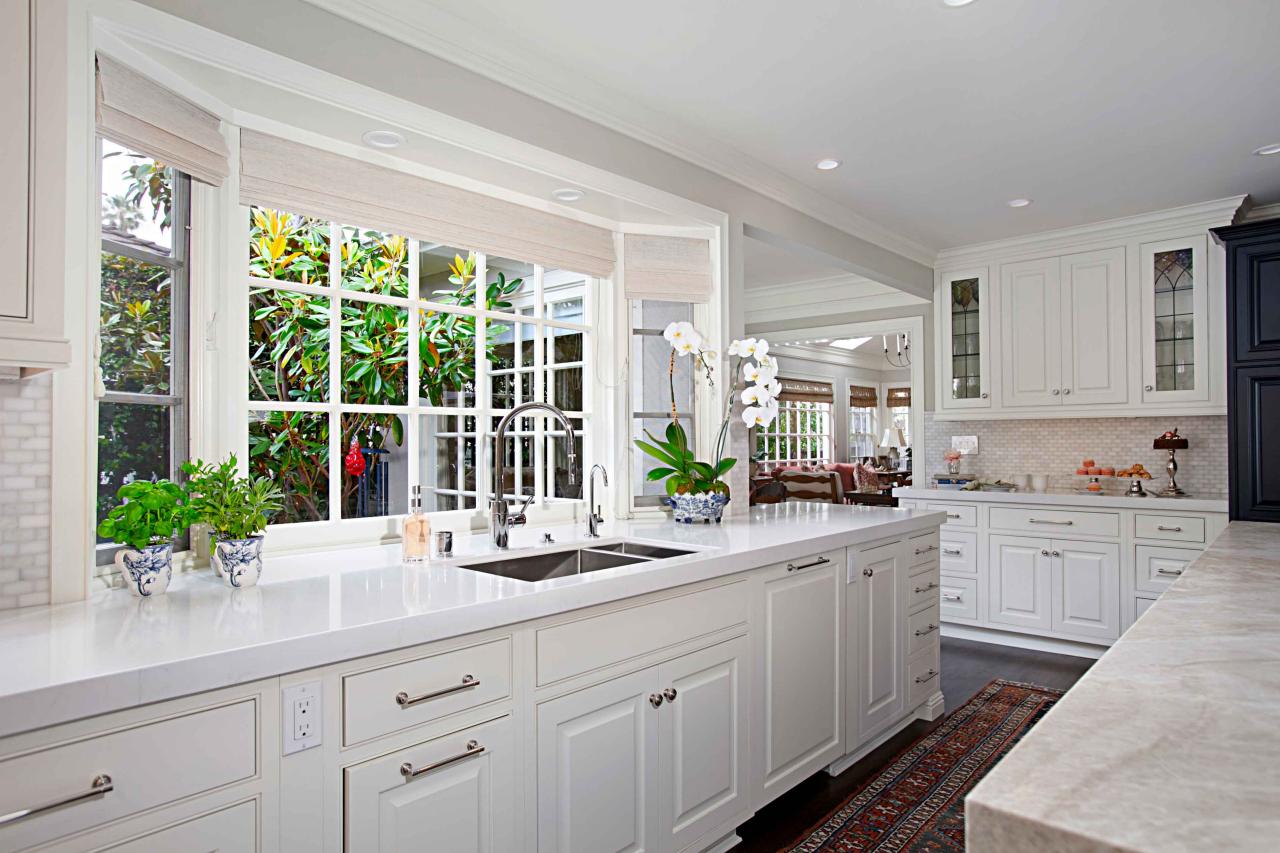 Large Bay Window Over White Countertop and Cabinets in ...