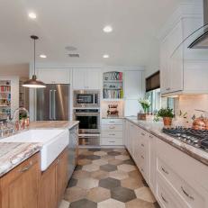 Island Farmhouse Sink, Neutral Marble Countertop and Abundant White Cabinetry in Transitional Kitchen