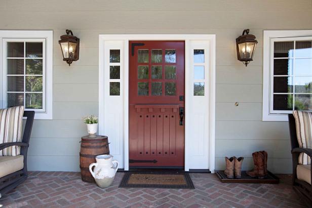 Deep Red Farmhouse Front Door With White Frame And Lantern