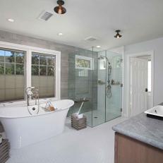 Modern Master Bath With Farmhouse Style Influence Featuring Glass Cube Shower and Deep White Bathtub 