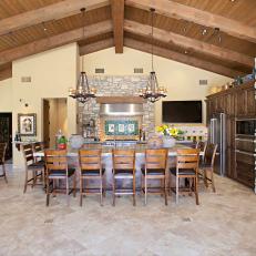 Yellow Open Plan Rustic Kitchen With Stone Walls