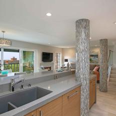 Gray Open Plan Kitchen With Mosaic Tile Columns