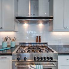 Stainless Steel Chef's Stove and Blue Jars