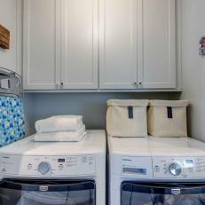 Laundry Room With Blue Ironing Board