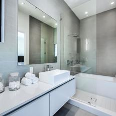 Gray Modern Bathroom With Glass Jars