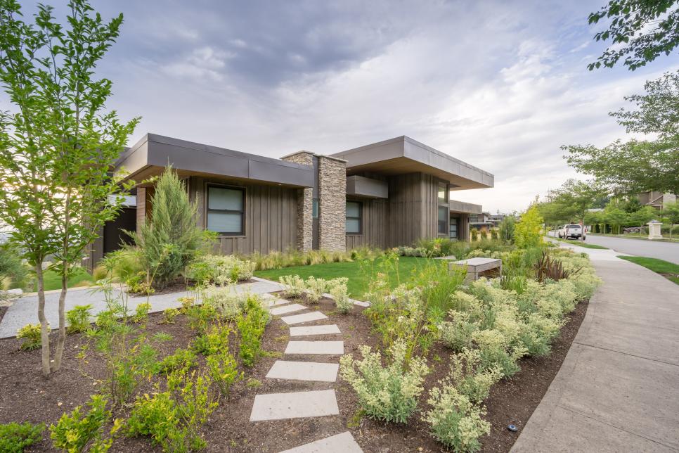 Gray Contemporary Exterior With Walkway and Green Shrubs