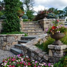 Custom Stone Stairs Lead to Backyard