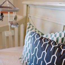 Blue and White Graphic Pillows in Crib