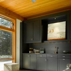 Charming Kitchenette With Dark Cabinetry