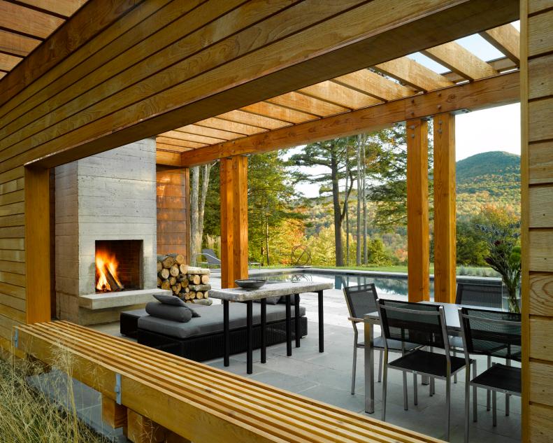 Contemporary Cedar Poolhouse With Outdoor Fireplace and Furniture