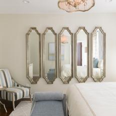 Series of Mirrors Reflects Natural Light in Master Bedroom