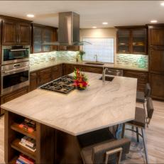 Contemporary Kitchen With Granite Topped Island With Built In Stove