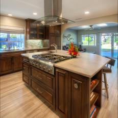 Contemporary Kitchen Island With Wooden Cabinets and Built in Stove