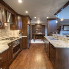 Contemporary Open Plan Kitchen With Island and Granite Countertop