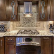 Contemporary Kitchen With Stove and Granite Countertop