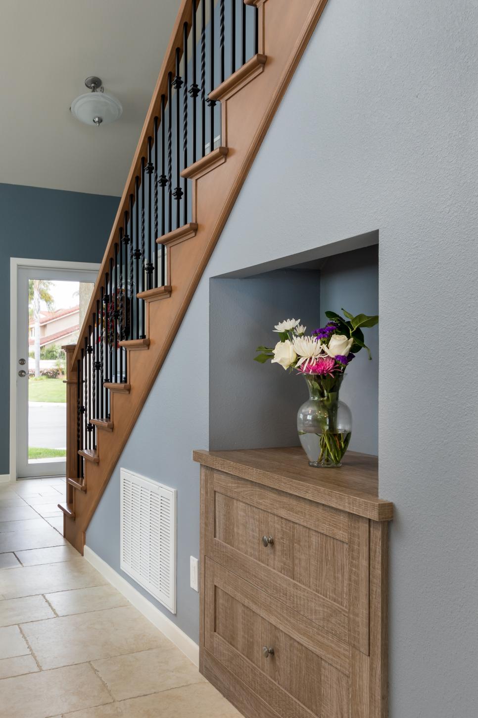 Newly Remodeled, Wrought Iron Stair Rail with Under-Stair Storage | HGTV