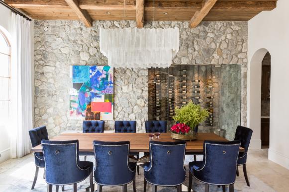 Dining Room With Blue Chairs, Stone Wall and Wood Ceiling