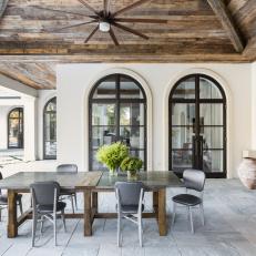 Covered Patio With Vaulted Wood Ceiling and Fireplace