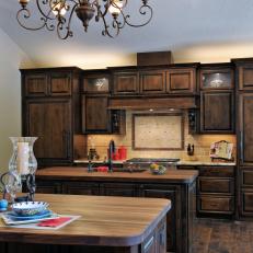 Mediterranean Kitchen With Dark Wood Cabinets