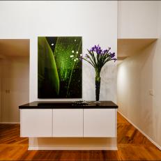 Black and White Cabinet and Purple Flowers