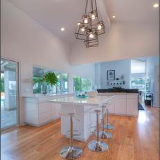 White Modern Open Plan Kitchen With Lucite Stools