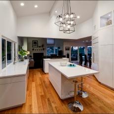 White Modern Open Plan Kitchen With Lucite Stools