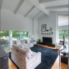 White Modern Living Room With Black Rug