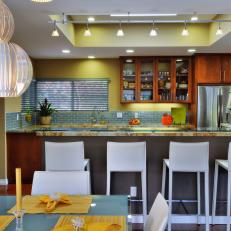 Blue and Yellow Open Plan Kitchen and Dining Area