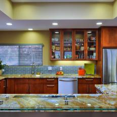 Yellow Open Plan Kitchen With Marbled Countertops
