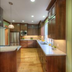 Green Open Plan Kitchen With Wood Floor