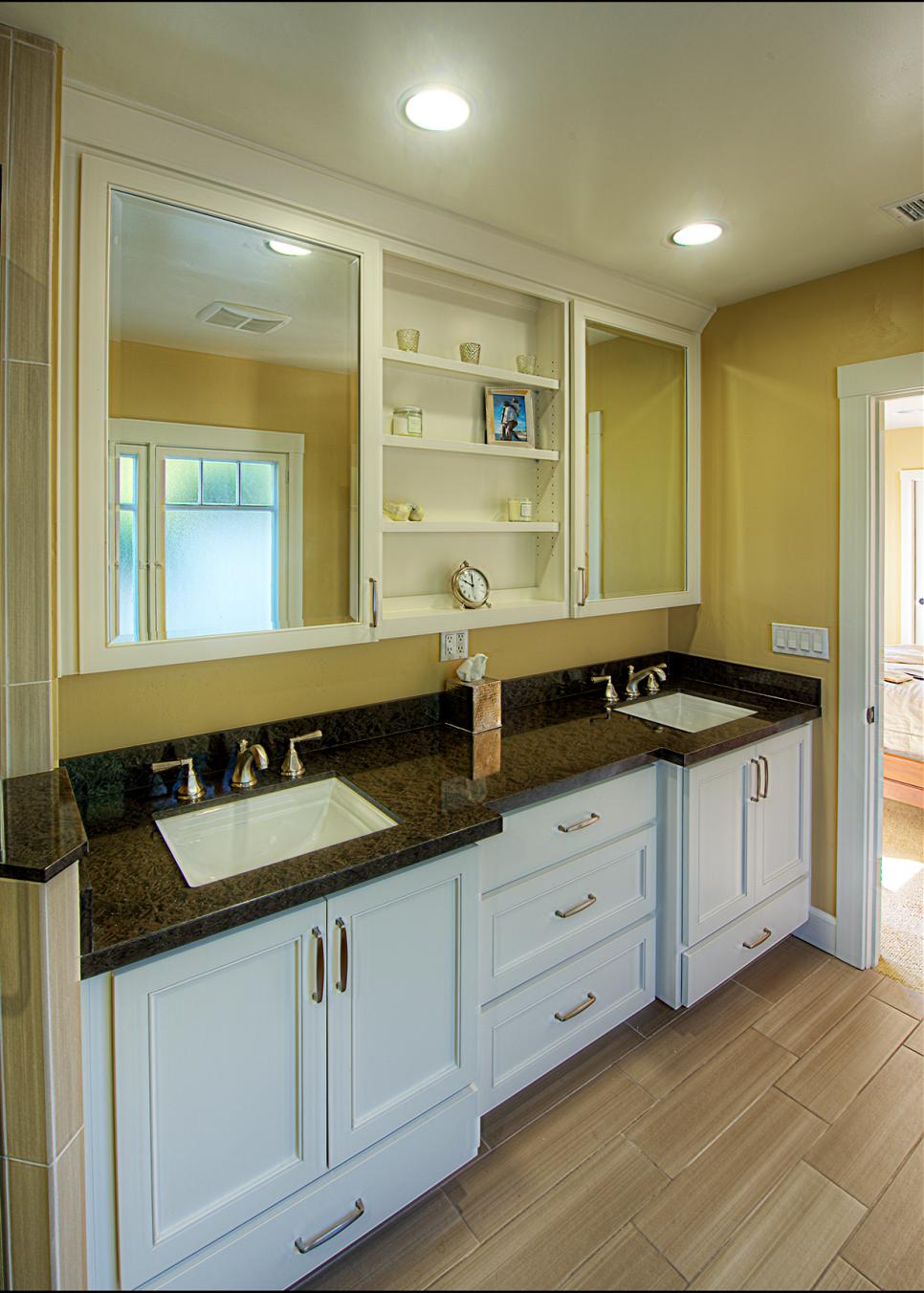 Yellow Double Vanity Bathroom With Black Countertops | HGTV