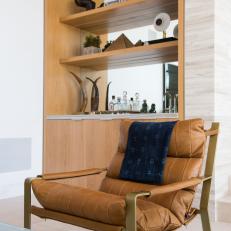 Brown Leather Armchair and Blue Throw