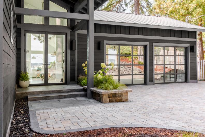 This wider view shows the garage’s close proximity to the front door of the home, and the new full view glass doors on the garage.