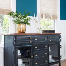 Contemporary Blue Dining Room with a Black Buffet  