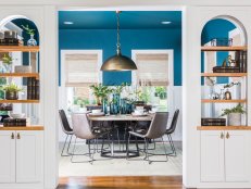 Blue Living and Dining Room with White Built-in Shelves 