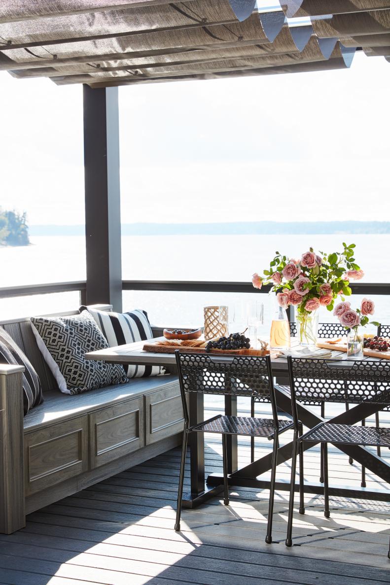 Combining modern, black dining chairs with gray benches keeps the seating versatile and dynamic.  The relaxed and inviting space makes it easy to kick back and enjoy the beauty of the Pacific Northwest.