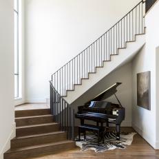 Staircase With Piano and Zebra Rug