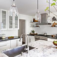 White Open Kitchen With Branches in Vase