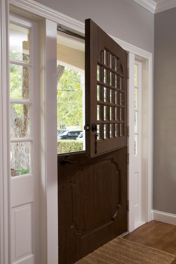 Fixer Upper Hosts Chip and Joanna Gaines kept the original Dutch front door and painted it with a faux finish to look like a dark stained wood grain, as seen on HGTV's Fixer Upper. (detail)
