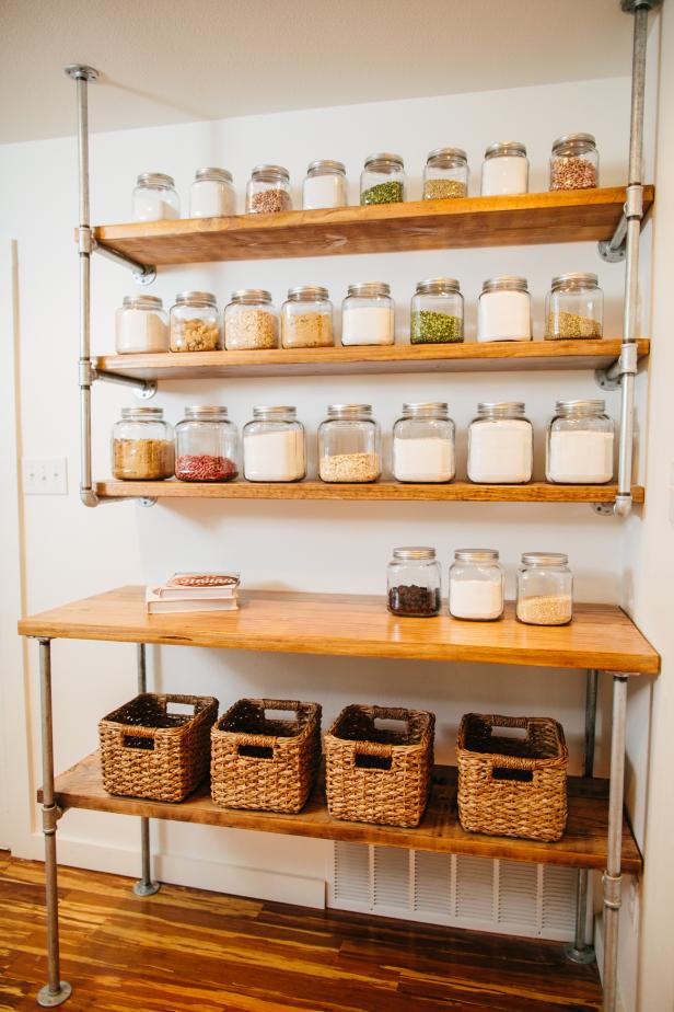 Canisters of spices sit on the these industrial shelves in the butler’s pantry. On the bottom shelf are baskets for additonal storage, as seen on Fixer Upper. (after)