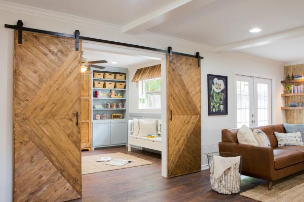 As seen on FIxer Upper, the Phipps' rennovated home now has a children's playroom off from the living room with barn doors for privacy when the room is used as a guest room. (After)