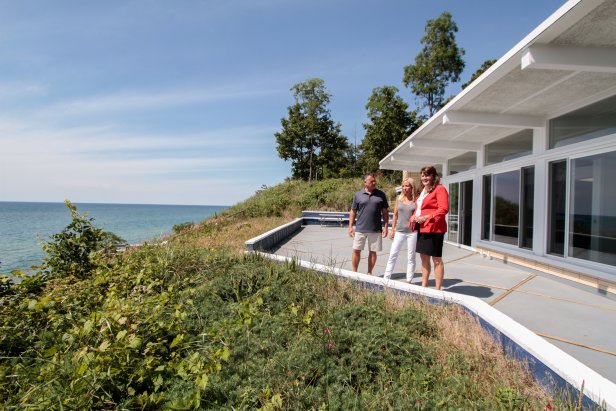 Real estate agent Ronda Busscher shows off the 75-feet of waterfront at the Cali Beach House to homebuyers Darren and Cindy, as seen on HGTV's Beach Hunters.