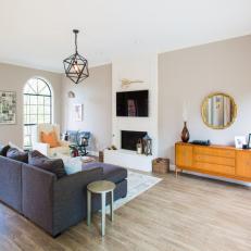 Gray Midcentury Living Room With Round Mirror