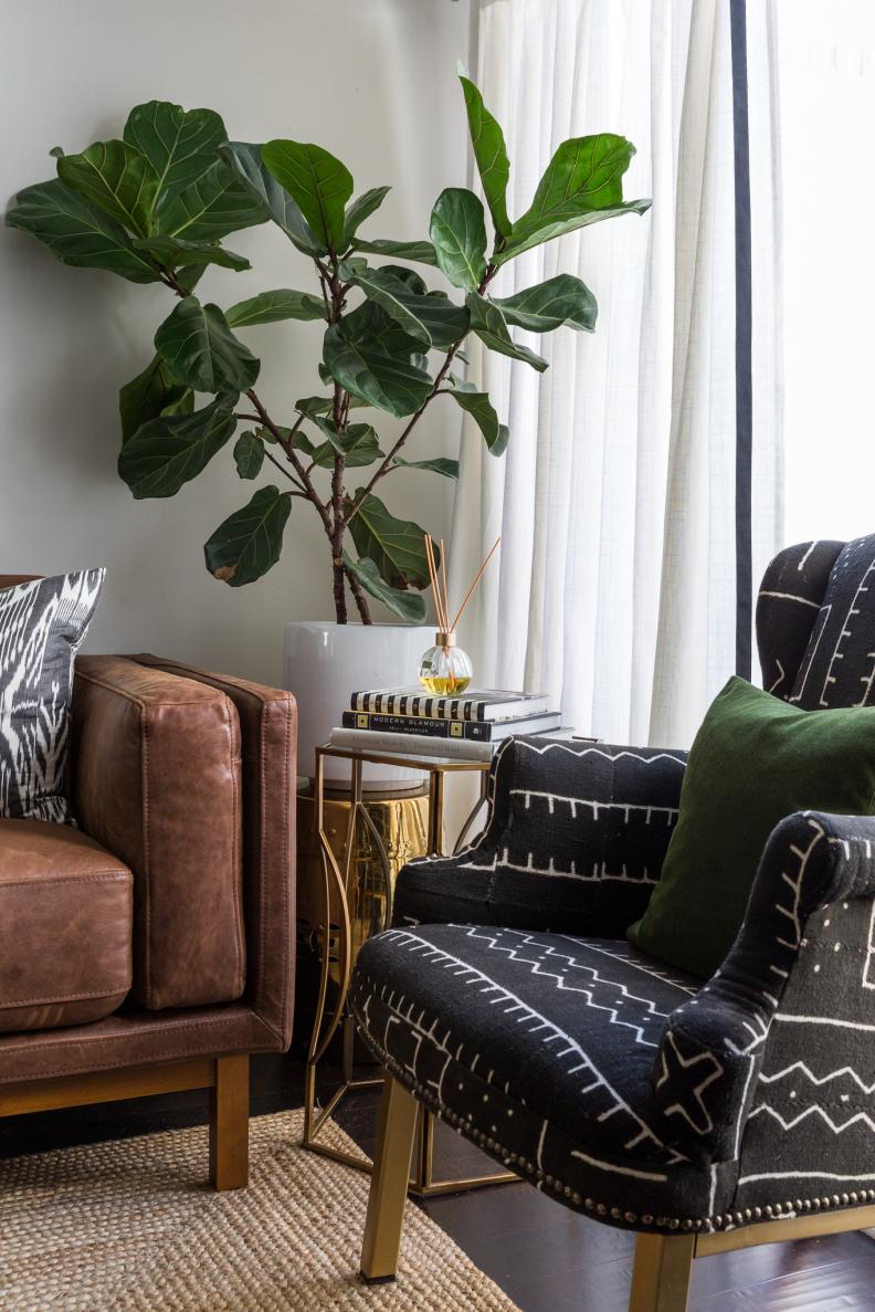 One of Naomi’s strengths as a designer is her ability to mix patterns. Here, a side chair reupholstered in Bogolan or “mud cloth,” from Mali creates an unexpected moment that gives the room a global, sophisticated feel.