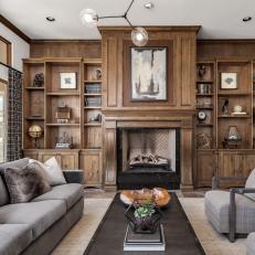 Grand Floor-to-Ceiling Fireplace With Built-In Bookshelves 