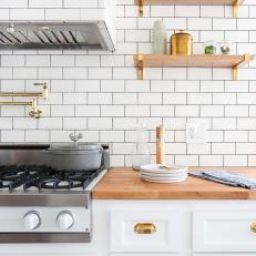 Kitchen With Plants and White Subway Tile