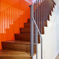 Contemporary Staircase with High-Gloss Panels on Accent Wall