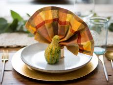Step up your place settings this holiday season with these clever and festive Thanksgiving napkin folding ideas.